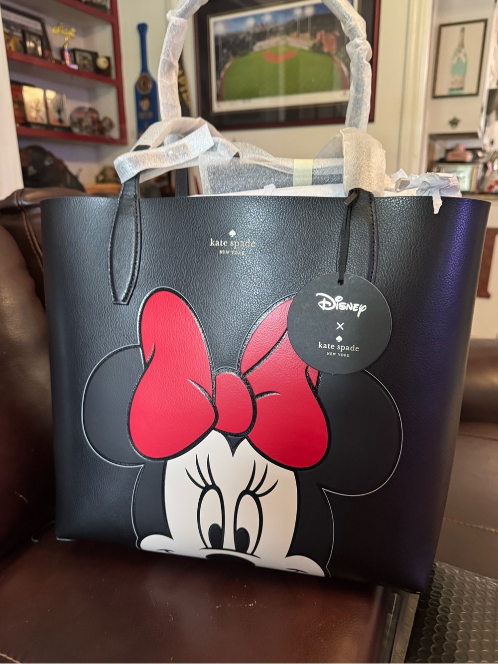 kate spade black leather tote with red Minnie Mouse bow